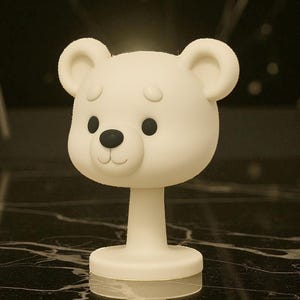 May include: A white bear-shaped decorative object with a round base and a slender stem. The bear has black eyes and a black nose, with a smiling mouth. The object is likely a lamp or a decorative piece.