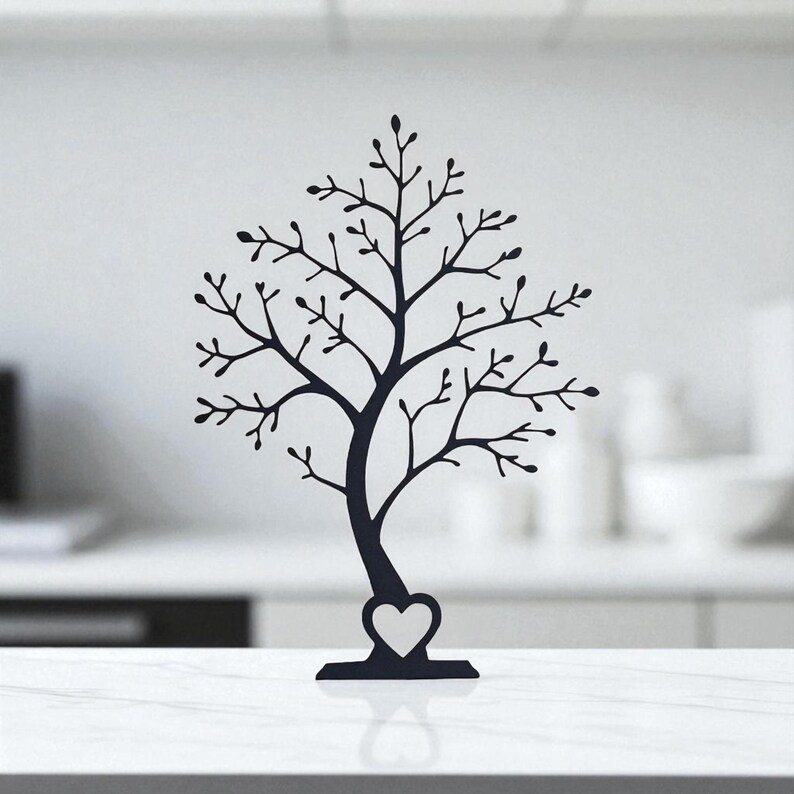 May include: A black metal tree-shaped jewelry holder with a heart-shaped base. The tree has many branches with small leaves, perfect for displaying necklaces, bracelets, and earrings. The jewelry holder is a decorative and functional item.