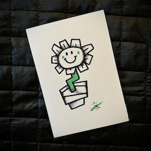 May include: A hand-drawn illustration of a smiling flower in a pot. The flower is white with black outlines and green eyes. The pot is white with black stripes and a green stem.