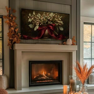 A vintage Christmas painting of mistletoe in a vase tied with a deep red bow. The artwork features warm golden and earthy tones, creating a moody, candle-lit atmosphere perfect for old-world Christmas décor. Ideal for Samsung Frame TV, this digital download adds elegance and nostalgia to any home, pairing beautifully with vintage, rustic, or dark academia holiday interiors.
