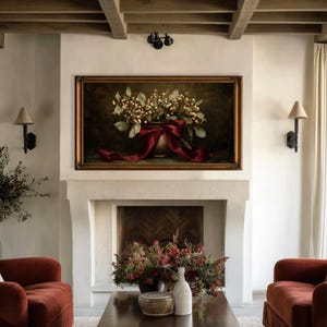 A vintage Christmas painting of mistletoe in a vase tied with a deep red bow. The artwork features warm golden and earthy tones, creating a moody, candle-lit atmosphere perfect for old-world Christmas décor. Ideal for Samsung Frame TV, this digital download adds elegance and nostalgia to any home, pairing beautifully with vintage, rustic, or dark academia holiday interiors.