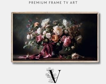 May include: A framed floral still life painting featuring a dark background and a vase overflowing with white, pink, and peach flowers. A burgundy ribbon drapes from the vase. The text "PREMIUM FRAME TV ART" and "VINTAGE HEIRLOOM ART COLLECTIVE" are visible.