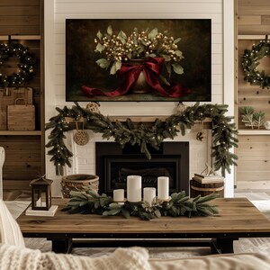 A vintage Christmas painting of mistletoe in a vase tied with a deep red bow. The artwork features warm golden and earthy tones, creating a moody, candle-lit atmosphere perfect for old-world Christmas décor. Ideal for Samsung Frame TV, this digital download adds elegance and nostalgia to any home, pairing beautifully with vintage, rustic, or dark academia holiday interiors.