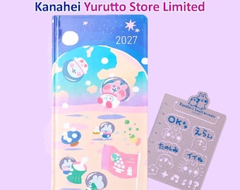May include: A Hobonichi Techo Weeks 2027 planner with a space-themed cover featuring Kanahei characters in astronaut helmets on a planet surface, plus a clear plastic stencil sheet with Kanahei's Small Animals and Japanese text icons.