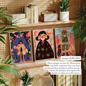 May include: Three framed illustrations with a whimsical and colorful style. The first illustration features a blue monster with a girl standing in front of it. The second illustration features a girl with a black cloak and a starry background. The third illustration features a person in a gas mask with a black dog and a fiery background. The text "@superskillsadhd" is at the bottom of the image.