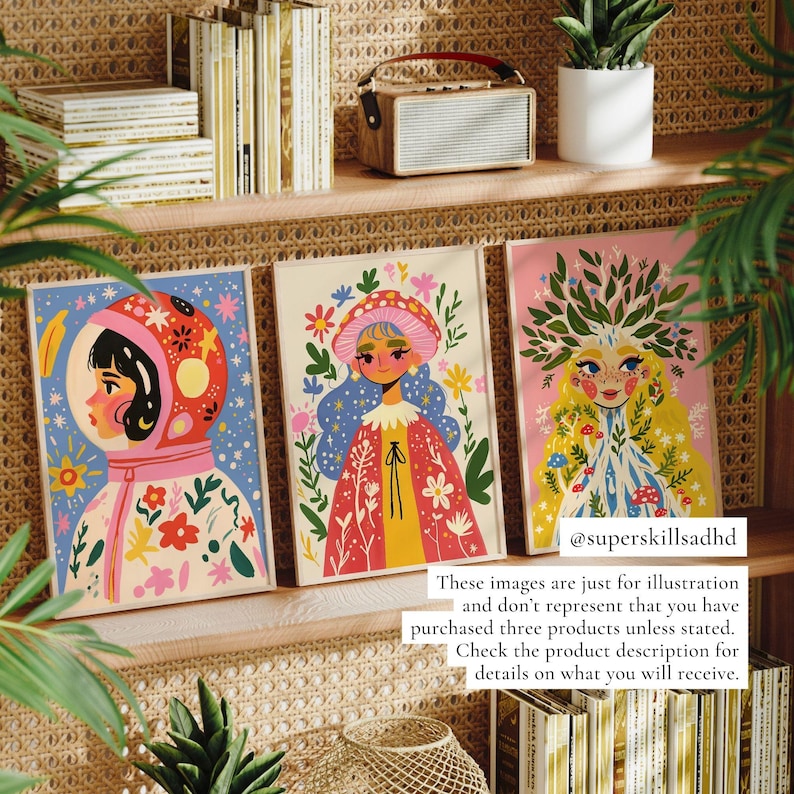 May include: Three colorful illustrations framed in wood. The illustrations feature a girl in a space suit, a girl in a mushroom hat, and a girl with a tree growing from her head. The illustrations are surrounded by flowers and other nature-inspired elements.