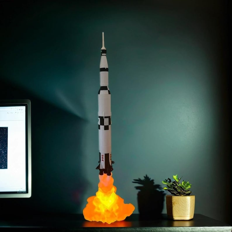 Night Light - Apollo 11 Saturn V Rocket Lamp, 60 cm tall, handcrafted from eco-friendly PLA. Soft, warm glow perfect for space lovers. A tribute to the first moon landing, ideal for home decor or a unique gift. Bring space exploration home!