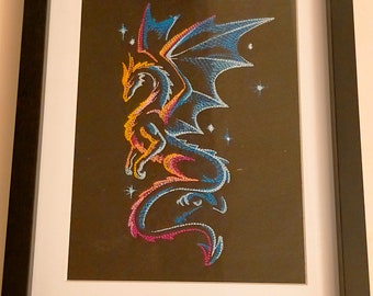 Embroidered dragon in frame