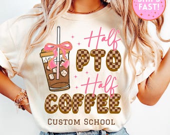 May include: A cream-coloured t-shirt featuring an iced coffee graphic and the text "Half PTO Half Coffee." The text is in brown and pink, with a checkered pattern on some letters. The words "Custom School" are at the bottom.