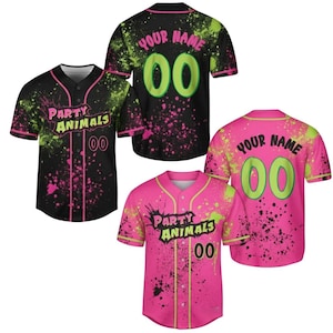 May include: Baseball jerseys in black and pink with neon green accents. The jerseys feature the text "PARTY ANIMALS" and "YOUR NAME" with the number "00". The design includes paint splatter.