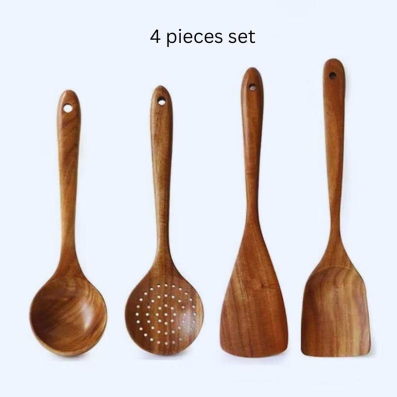 May include: A collection of four wooden kitchen tools: a spoon, slotted spoon, spatula, and turner. The utensils are crafted from light brown wood and have a polished surface. The text "4 pieces set" is displayed above the items.