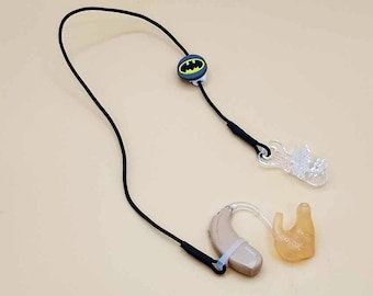 Black single retention cord for hearing aid or cochlear implant