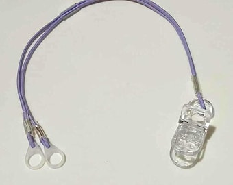 Customizable bilateral retention cord with clip cochlear implant and hearing aid