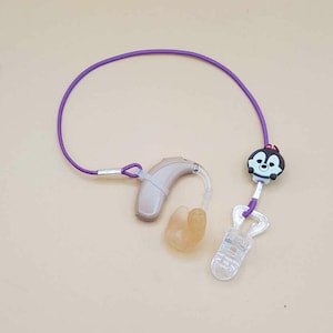 Lila einzelnes Hörgeräte-Rückhalteband mit Clip für das Cochlea-Implantat