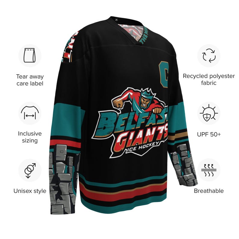 May include: Black hockey jersey with teal and red stripes. The jersey features a large graphic of a cartoon character with a crown and the text "Belfast Giants Ice Hockey".