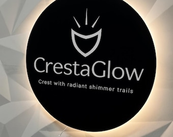 May include: A round black sign with the text "CrestaGlow" and a crest logo. The sign is illuminated with a warm light and hangs against a white geometric wall. The text below reads "Crest with radiant shimmer trails."