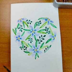 carte de voeux à l'aquarelle illustration cœur fleuri bleu