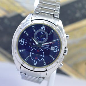 Reloj deportivo Vagary con cronógrafo, multifunción, estilo de carreras, para hombre, con fecha y un diseño llamativo.