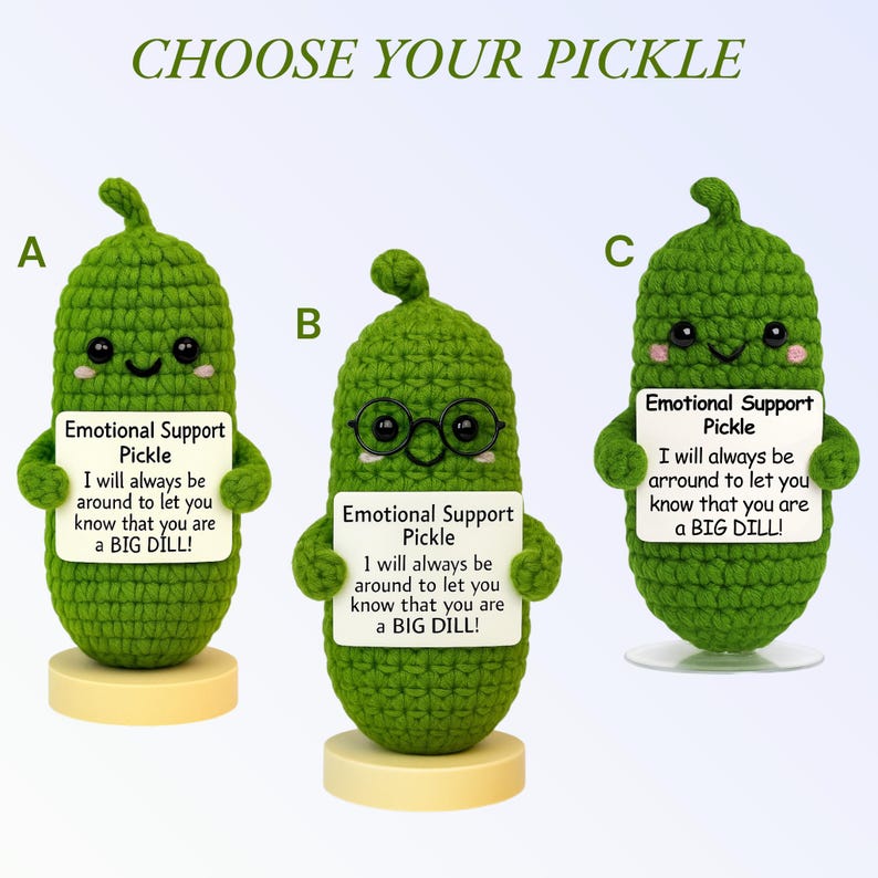 May include: Three green crocheted pickle figures, each holding a sign that reads "Emotional Support Pickle." The text on the signs says "I will always be around to let you know that you are a BIG DILL!" One pickle wears glasses.