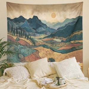 May include: A tapestry featuring a stylized landscape with mountains, fields, and a sun. The color palette includes blues, greens, and browns, with gold accents. The tapestry is displayed above a bed with pillows and a tray.