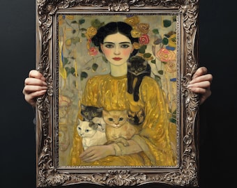 May include: A framed portrait of a woman in a yellow dress, holding several cats. The artwork features a woman with dark hair and a floral headpiece. The cats are various colors, including black, white, and orange. The frame is ornate and brown.