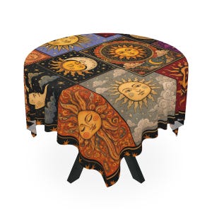 May include: A round tablecloth featuring a multi-panel design with celestial motifs. Each section displays stylised suns and moons with human faces in shades of orange, yellow, and blue, set against backgrounds of starry night skies and clouds.