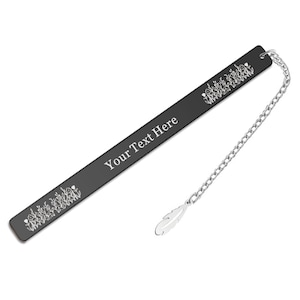 May include: Black bookmark with a silver chain and feather charm. The bookmark has a floral design and the text "Your Text Here" engraved on it.