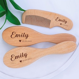 May include: A set of three wooden hair brushes with the name "Emily" and the date "05.09.2024" engraved on each. The set includes a comb and two oval-shaped brushes.