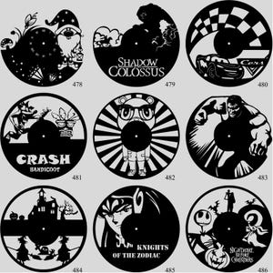 May include: A collection of black vinyl record clocks featuring various designs. The designs include a gnome with a clock face, the words "Shadow Colossus", a race car, Crash Bandicoot, a bear with glasses, the Hulk, a haunted house, "Knights of the Zodiac", and "Nightmare Before Christmas".