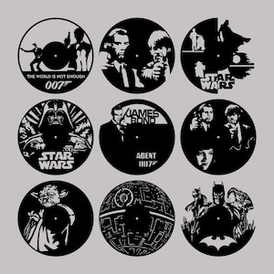 May include: Nine black and white circular vinyl record designs featuring popular movie characters and logos. The designs include Darth Vader, Yoda, the Death Star, James Bond, and Batman.