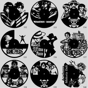 May include: A collection of black vinyl record clocks featuring anime characters and logos. Designs include characters from "Attack on Titan", "One Piece", and "Academia Midoria Deli". Each clock has a central circular dial.