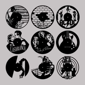 May include: Nine black and white vinyl record clock designs. The designs include a brick wall with the words "Pink Floyd", a guitar with the words "AC/DC", a couple from the movie "Casablanca", a couple from the movie "Dirty Dancing", a guitar, a couple from the movie "Titanic", and a woman with a cat.