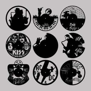 May include: Nine black and white vinyl record clock designs featuring various music themes, including The Wall, Pink Floyd, Kiss, Jazz, and AC/DC. Each design includes a clock face in the center.