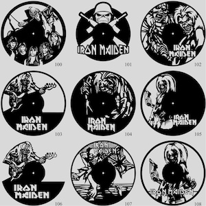 May include: A collection of black vinyl record art featuring Iron Maiden band imagery. Each record has a unique design, including band members, the band's logo, and album art. The records are numbered 100 through 108.