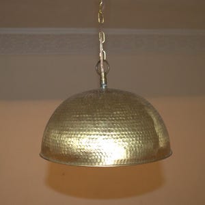 Brass dome pendant lamp.