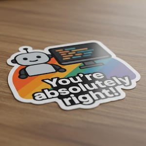 May include: A sticker featuring a cartoon robot and a computer monitor with code, set against a rainbow background. The sticker has the text "You're absolutely right!" in white, with a black keyboard in the background.