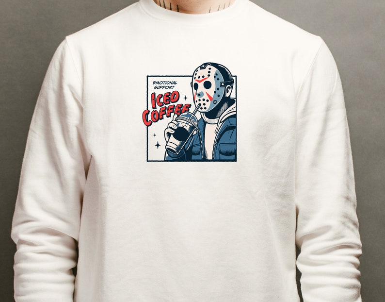 SVGPNG illustration of the famous horror character drinking iced coffee through his mask, labeled with the text Emotional Support Iced Coffee. This Quirky and humorous design blends the iconic Halloween horror with coffee culture