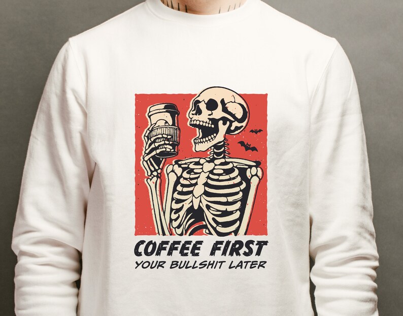 SVG PNG illustration of a skeleton holding a coffee cup with the humorous text Coffee first, Your bullshit later, designed in a playful style to celebrate Halloween. This quirky design combines a love for coffee with a cheeky message.