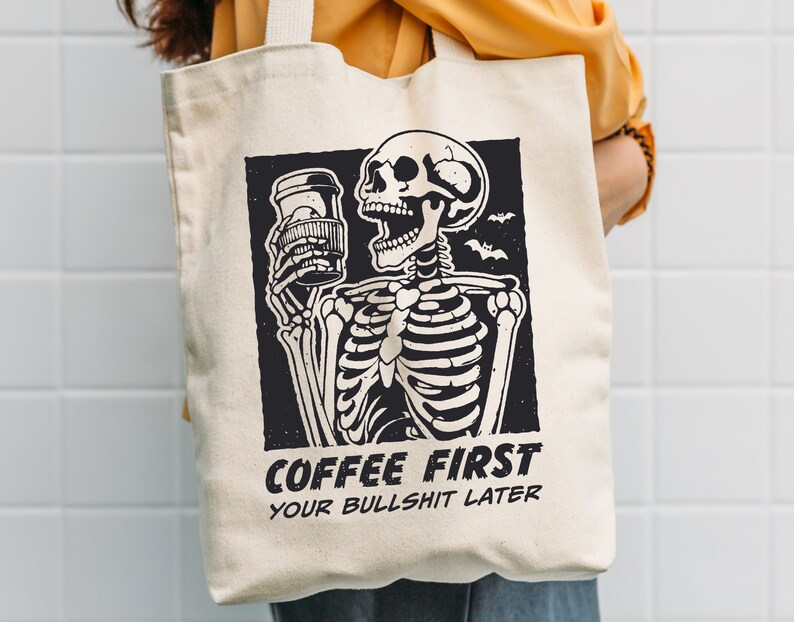 SVG PNG illustration of a skeleton holding a coffee cup with the humorous text Coffee first, Your bullshit later, designed in a playful style to celebrate Halloween. This quirky design combines a love for coffee with a cheeky message.