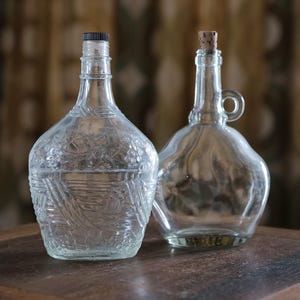 2 vintage glass bottles made in Portugal in the 1970s
