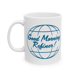 May include: White ceramic mug with a blue globe design and the text "Good Morning Refiner!" printed on it.