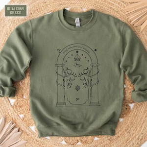 May include: A green sweatshirt with a black outline of a doorway with the text "all that is gold does not glitter, not all those who wander are lost; the old that is strong does not wither, deep roots are not reached by the frost. From the ashes a fire shall be woken, a light from the shadows shall spring; renewed shall be blade that was broken, the crownless again shall be king."