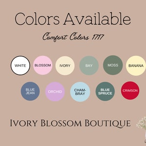 May include: A chart showing the color options available for Comfort Colors 1717 apparel. The colors include white, blossom, ivory, bay, moss, banana, blue jean, orchid, cham-bray, blue spruce, and crimson.