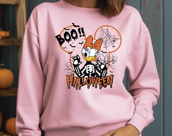 Celebra Halloween con estilo con esta adorable sudadera de esqueleto de pato. ¡Con un toque espeluznante y un aire otoñal pastel!