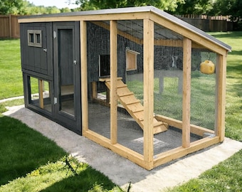 May include: A large, wooden chicken coop with a dark gray painted exterior and a natural wood frame. The coop features a wire mesh enclosure, a ramp, and a small window. A yellow hanging feeder is visible.