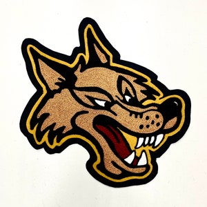 May include: An embroidered patch of a snarling wolf's head, with brown fur and a black outline, and a red tongue.
