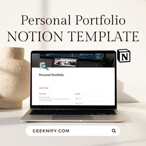May include: A laptop computer displaying a website with the title "Personal Portfolio" and the text "John Doe". The website is a Notion template for creating a personal portfolio. The laptop is on a white surface with a beige vase.
