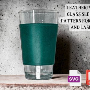 May include: A teal leather sleeve for a pint glass. The sleeve is made to fit a standard pint glass and is designed to be used with a laser cutter or printer. The image includes the text "LEATHER PINT GLASS SLEEVE PATTERN FOR PRINT AND LASER" and the file types "SVG" and "PDF".
