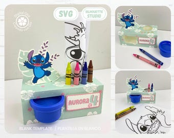 May include: A green and white cardboard box with a blue Stitch character on the front. The box has a cutout for a small container and a slot for crayons. The box is labeled "Aurora 4".