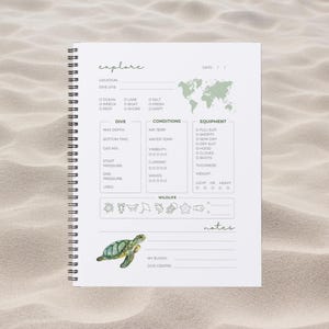May include: A white logbook with a green world map and a green sea turtle illustration. The logbook is titled "explore" and has sections for dive site, dive conditions, equipment, wildlife, and notes.